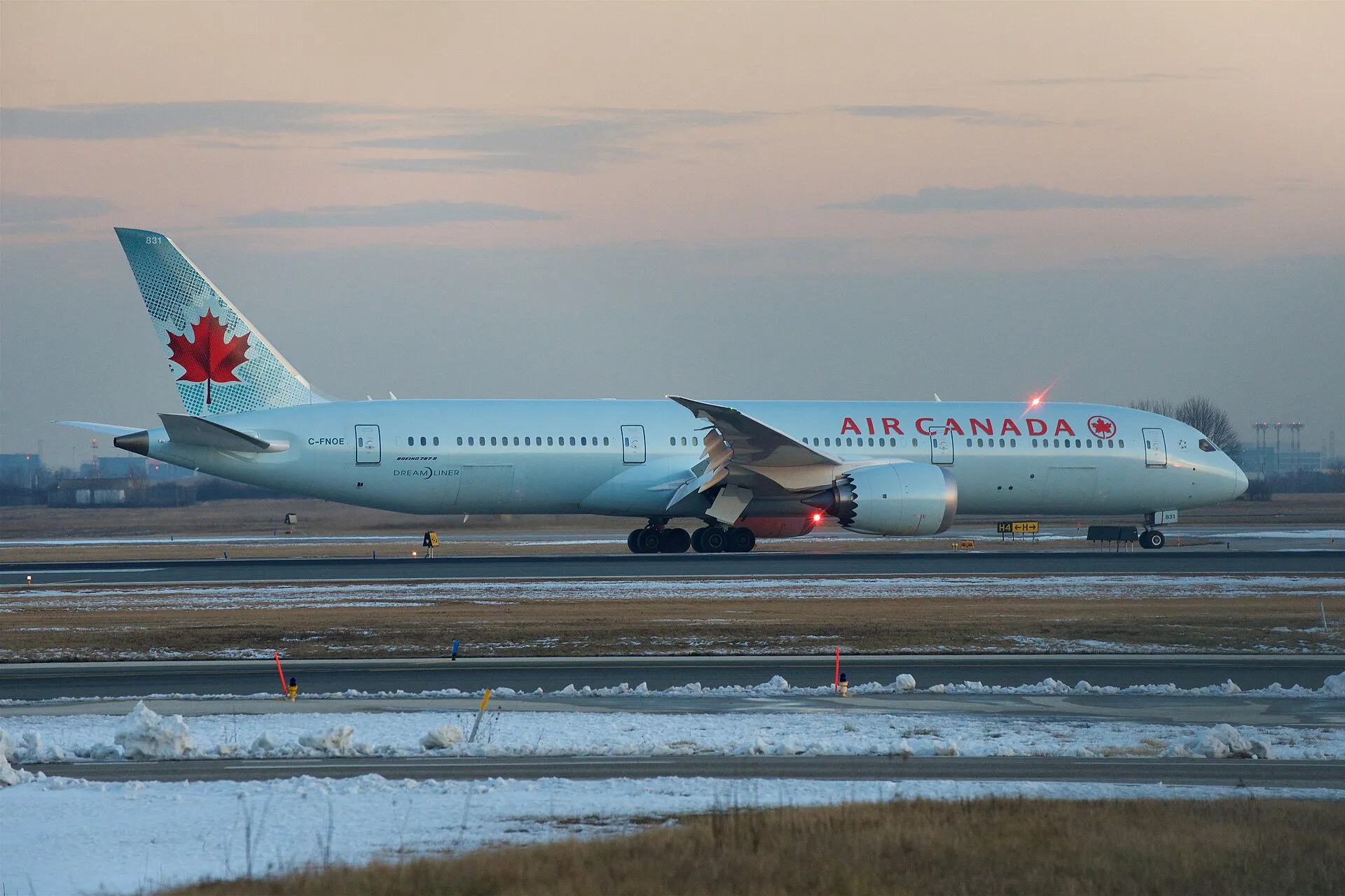 Air Canada Boeing 787-9 Dreamliner (C-FNOE) on the runway at dusk