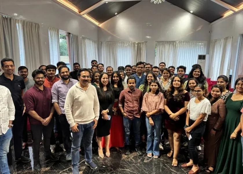 Cymetrix Software team posing for a group photo at an offsite gathering
